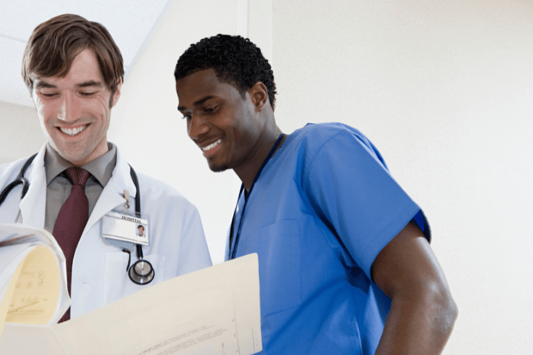 doctor and nurse looking at a document