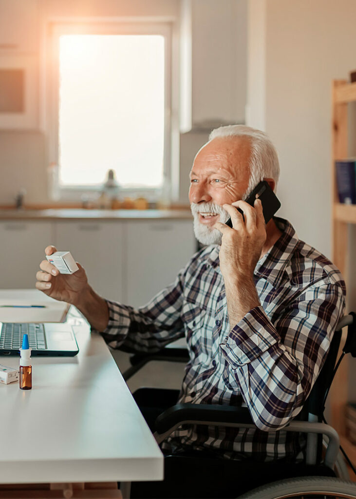 elderly man speaking to remote patient care company